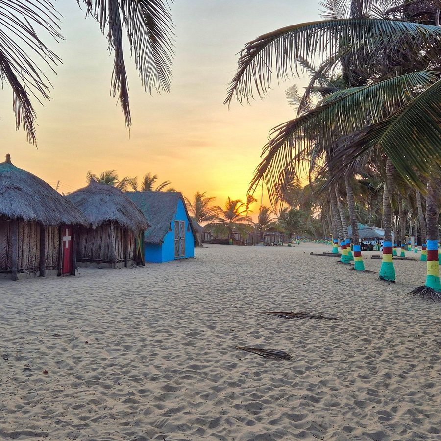 Palm-lined sandbar where the Volta River meets the Atlantic