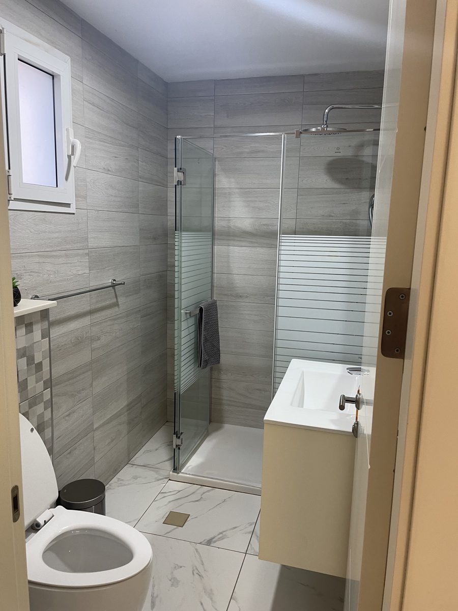 En-suite bathroom with glass shower at AAG Residence