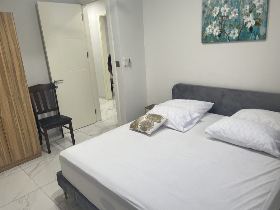 Bedroom with welcome tray at AAG Residence