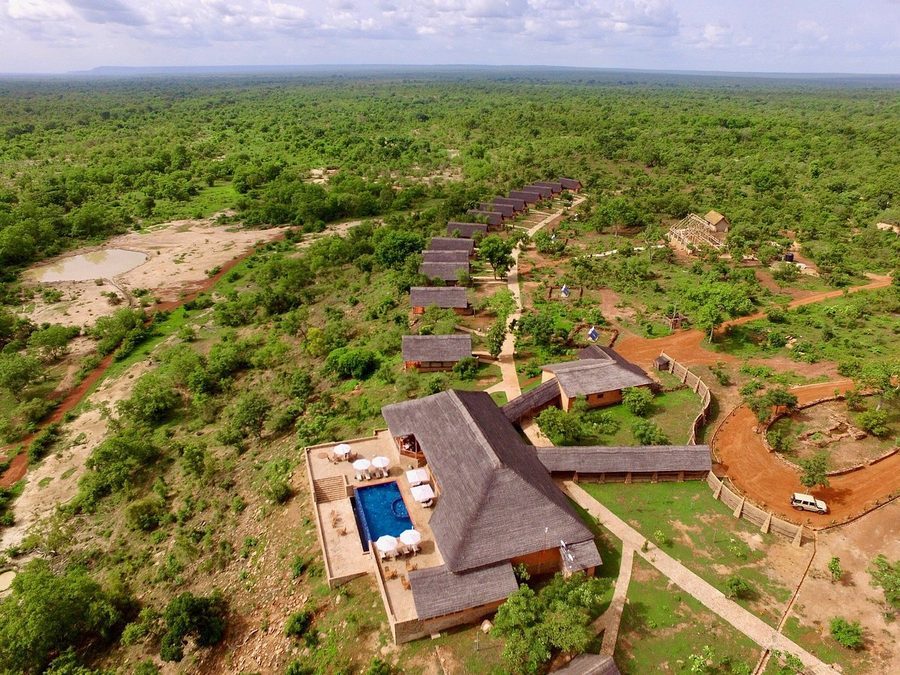 Aerial view of a safari lodge and pool overlooking Mole National Park